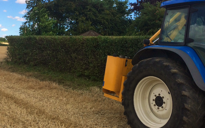 T wasteney  with Hedge cutter at United Kingdom