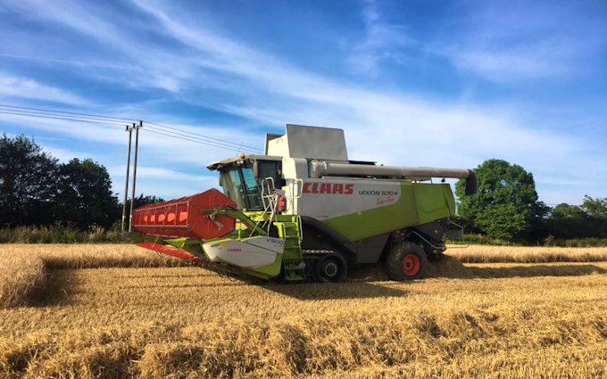 Norfolk straw products ltd with Combine harvester at United Kingdom