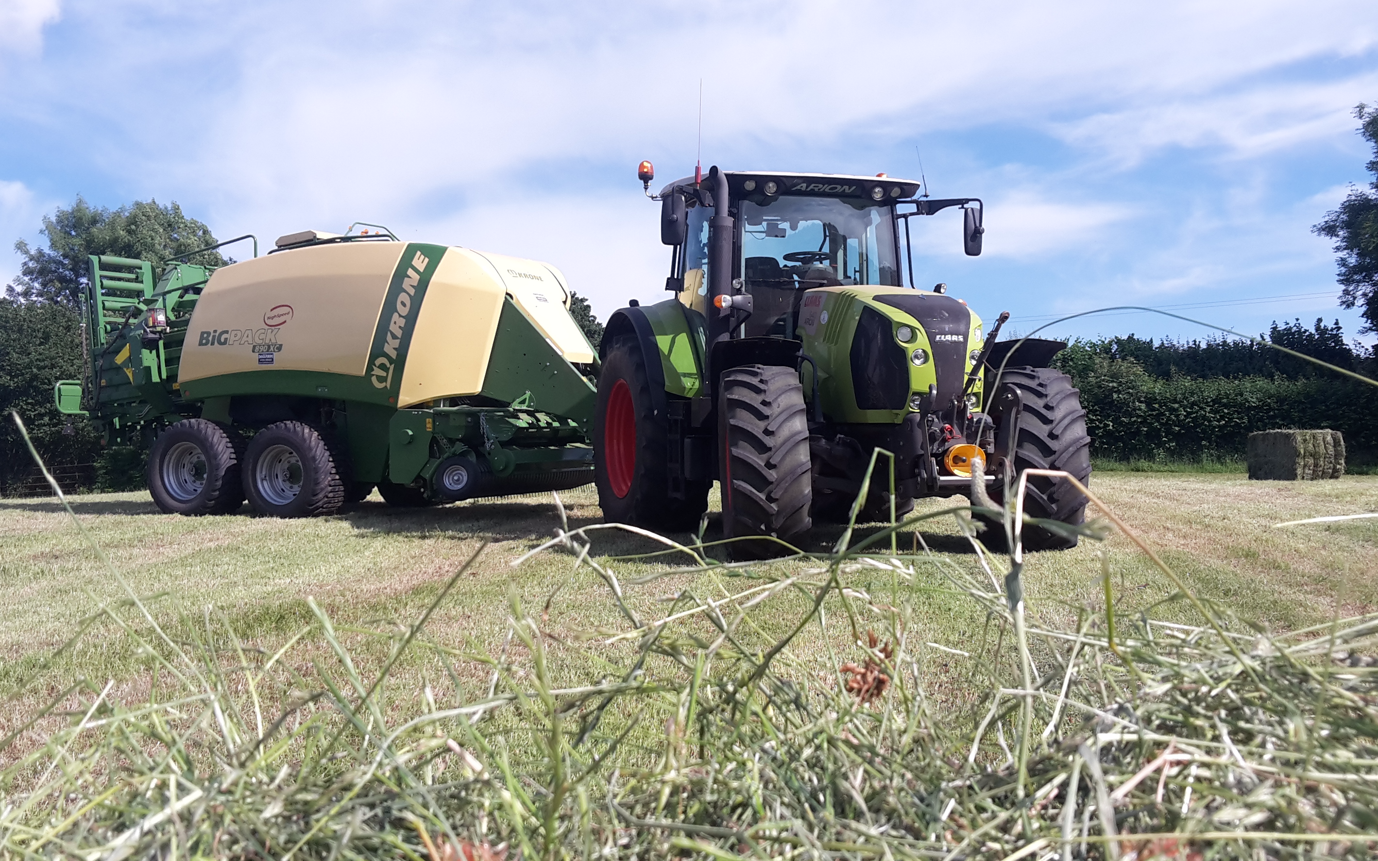 Landmarc agri services and sons with Large square baler at United Kingdom
