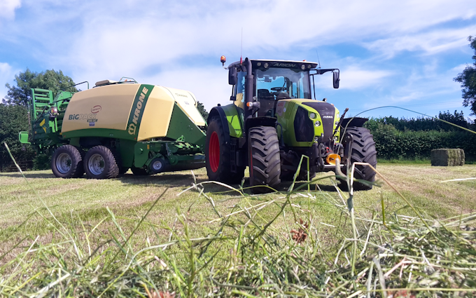 Landmarc agri services and sons with Large square baler at United Kingdom