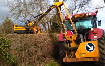 A chowns agricultural services  with Hedge cutter at Cookhill