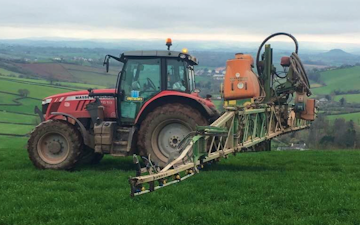 Wildwoods contractors with Tractor-mounted sprayer at United Kingdom