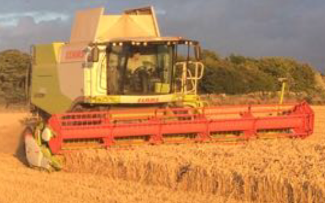 Jj peace & sons ltd with Combine harvester at United Kingdom