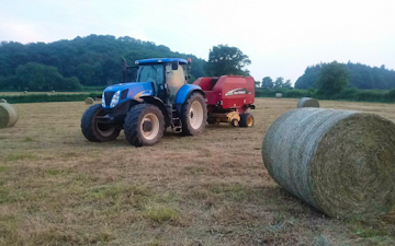 Oakfield contracting with Round baler at United Kingdom