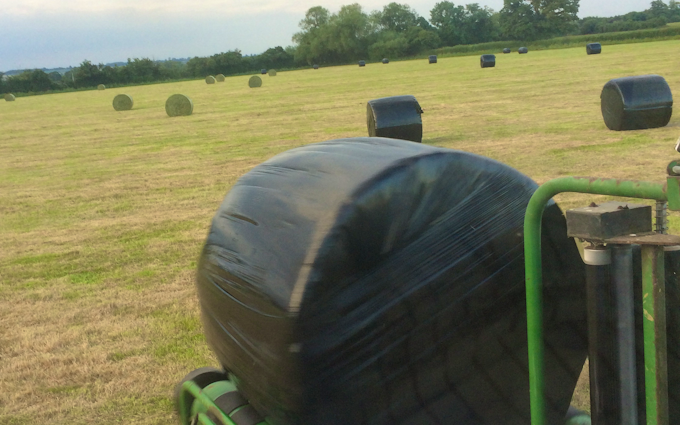 Zac bessell agricultural services with Round baler at United Kingdom
