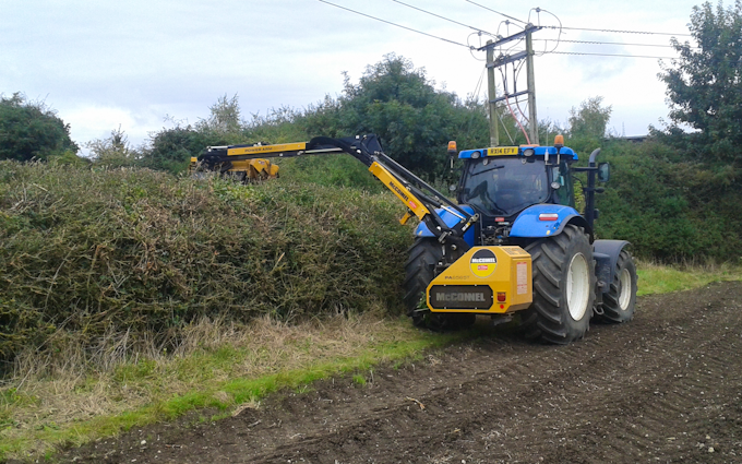 Rd agri contractor with Hedge cutter at West Lavington