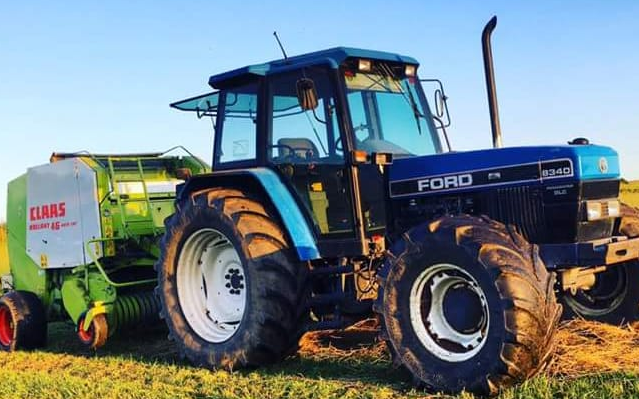 Ian milne & son  contractors ltd with Round baler at Clola