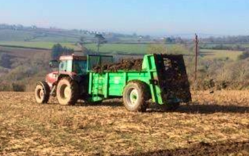 Trever verran agriculture contracting with Manure/waste spreader at Duloe