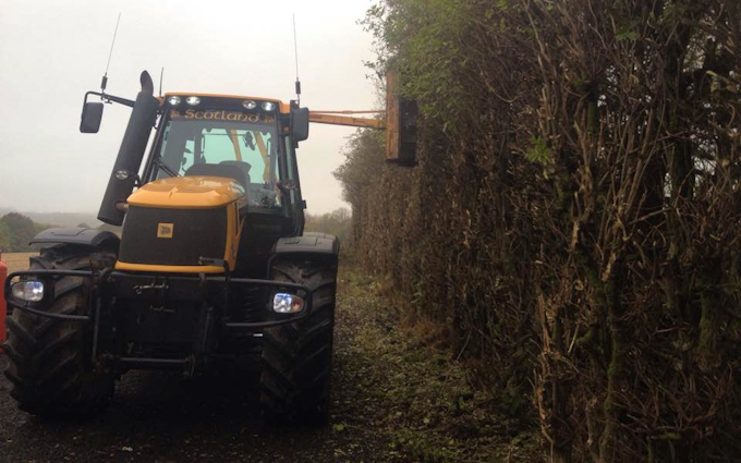 J. steel contracting  with Hedge cutter at Cauldhame Farm Road