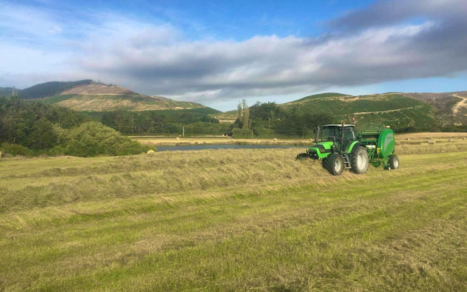 Searle contracting ltd  with Round baler at Hororata