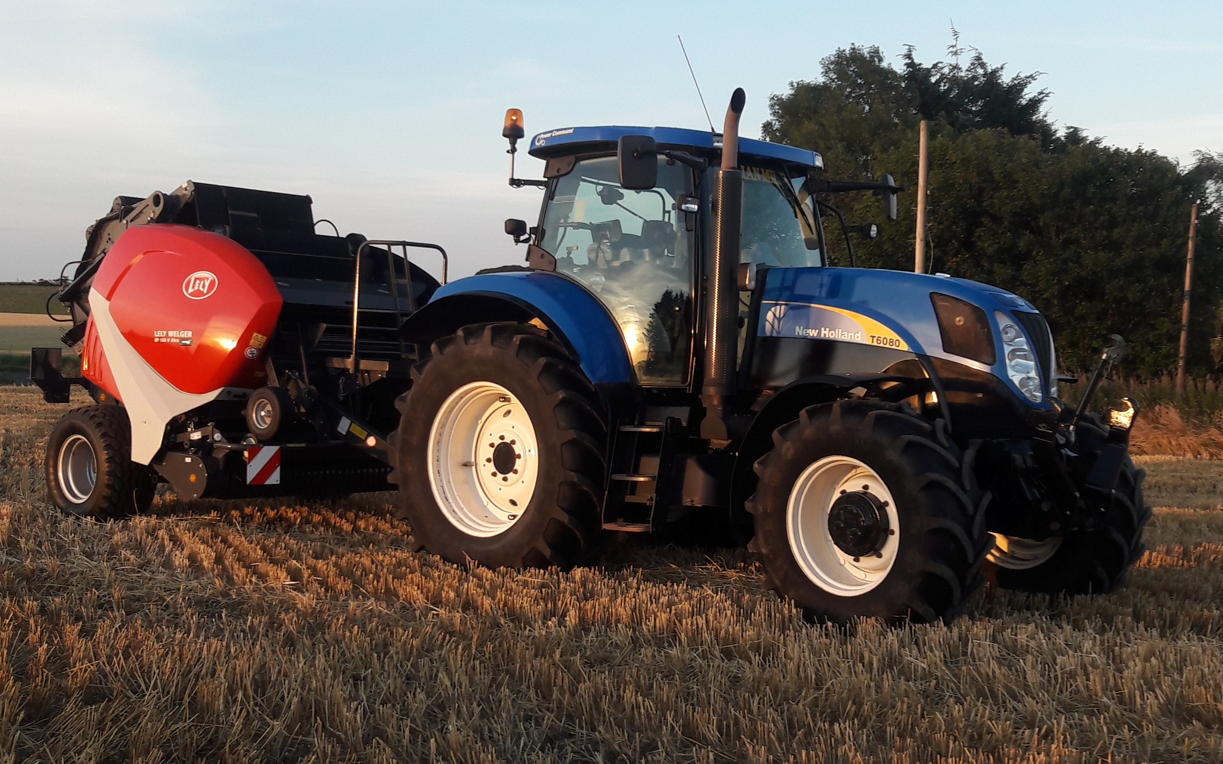 Ian milne & son  contractors ltd with Round baler at Clola