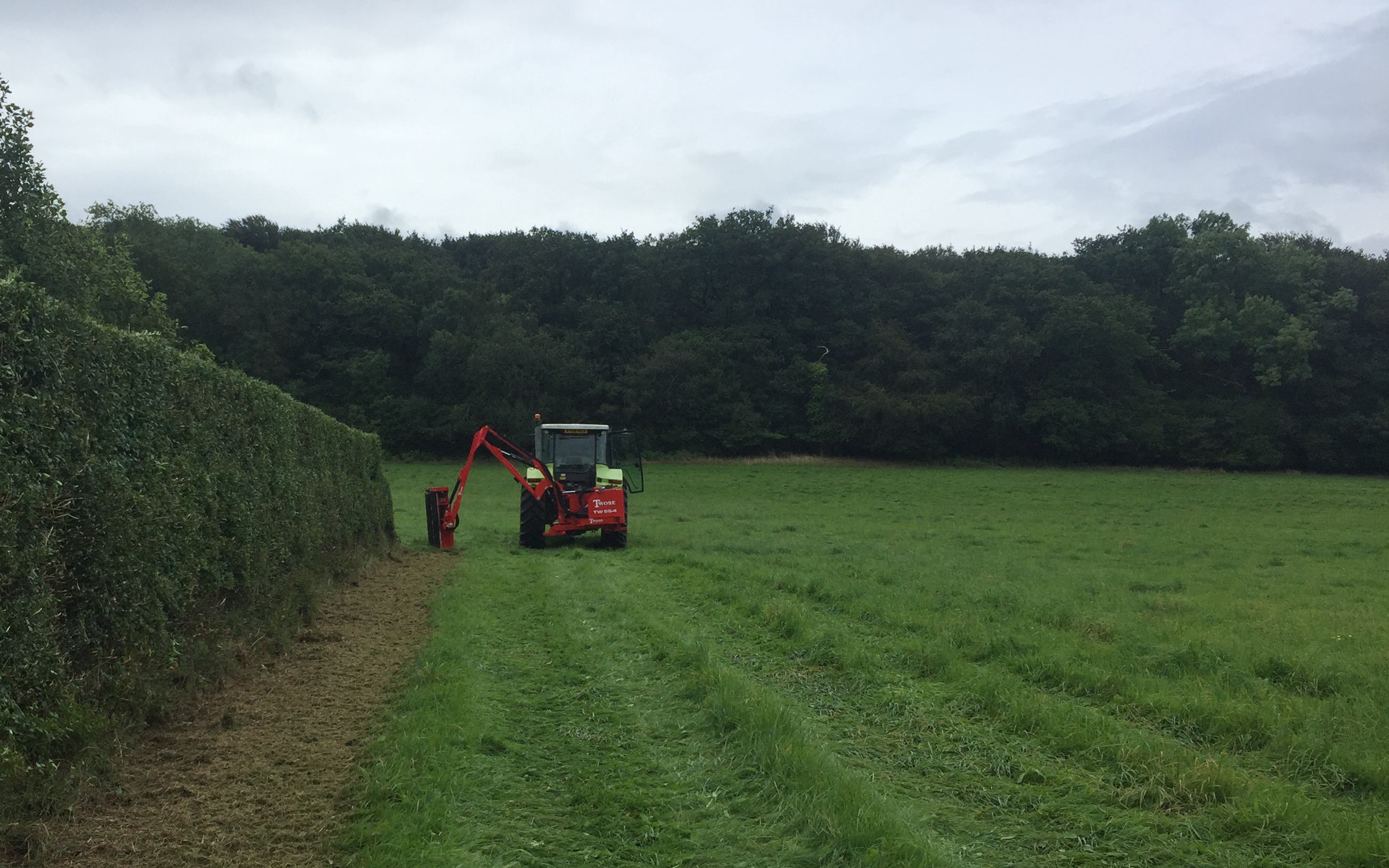 Bright’s agri contracting with Hedge cutter at Barn Park