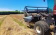 Maugers rural contracting  with Windrower at Rolleston